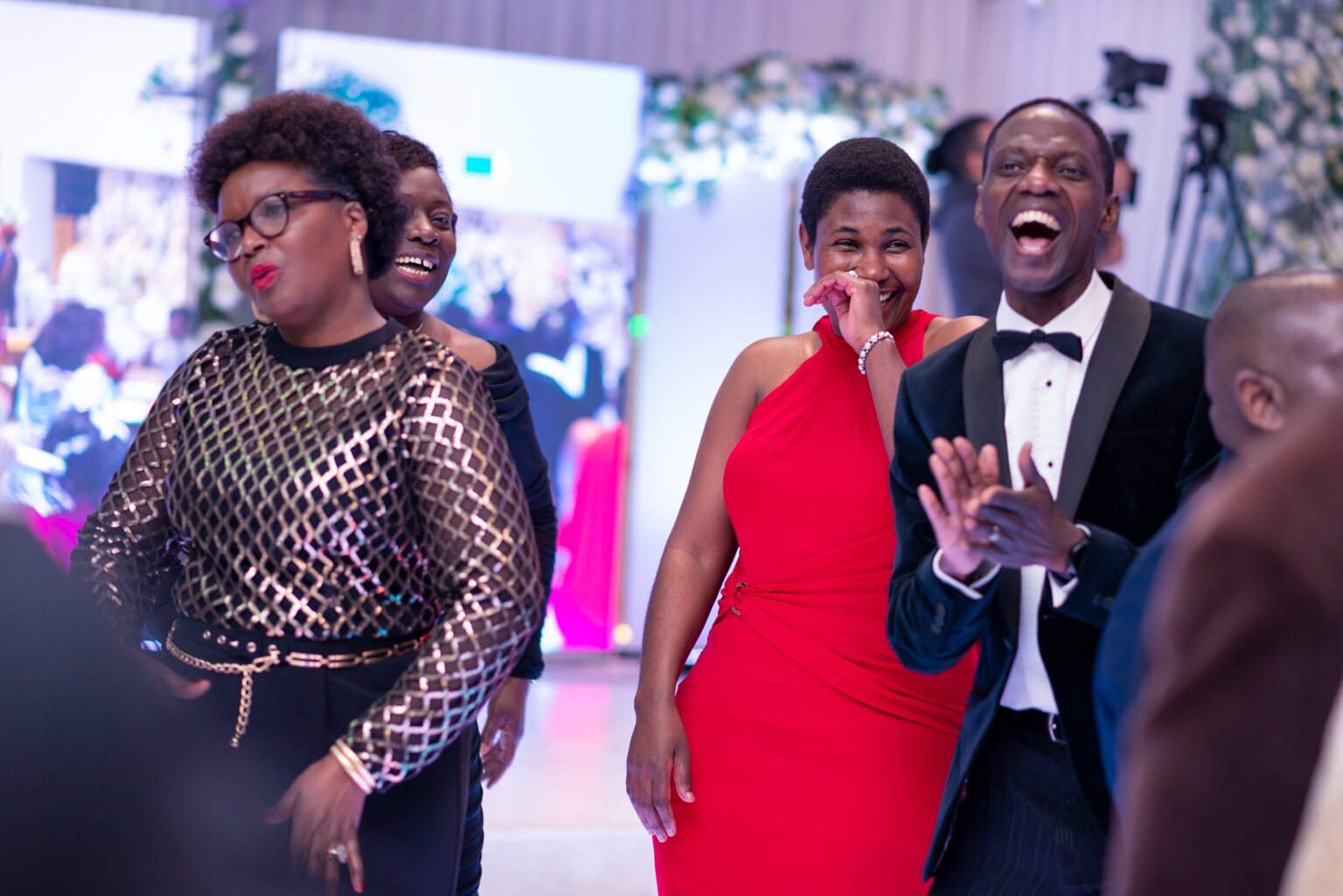 Smiling guests enjoying the evening together at the 2024 Grille Community Christmas Gala