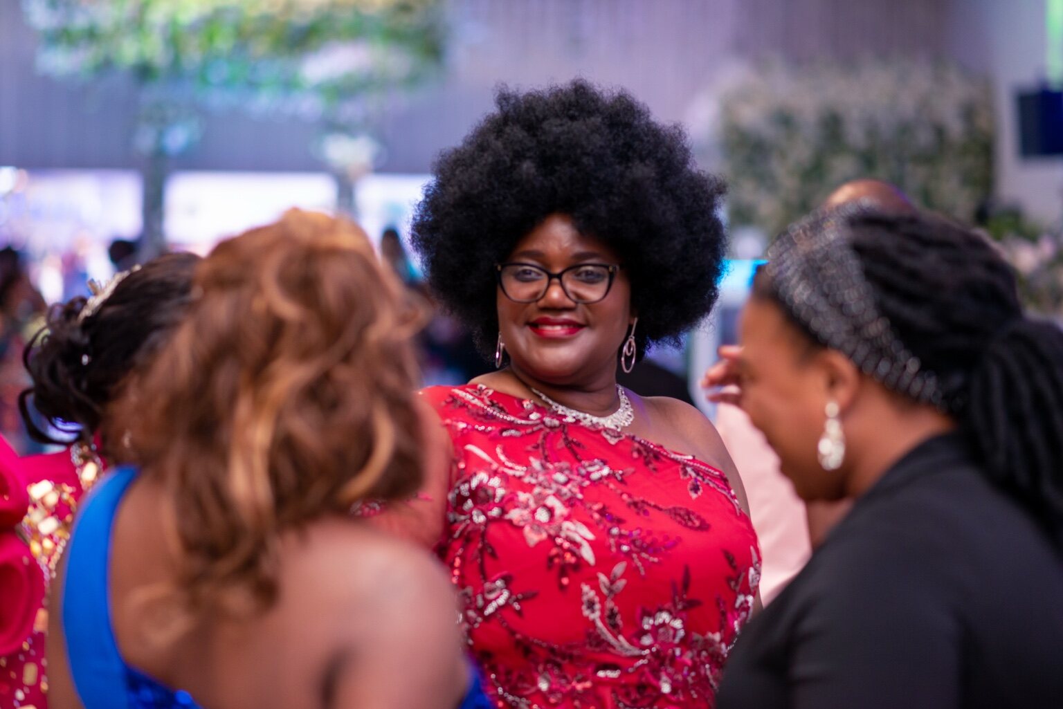 Guests connecting around the tables and across the venue at the 2024 Grille Community Christmas Gala