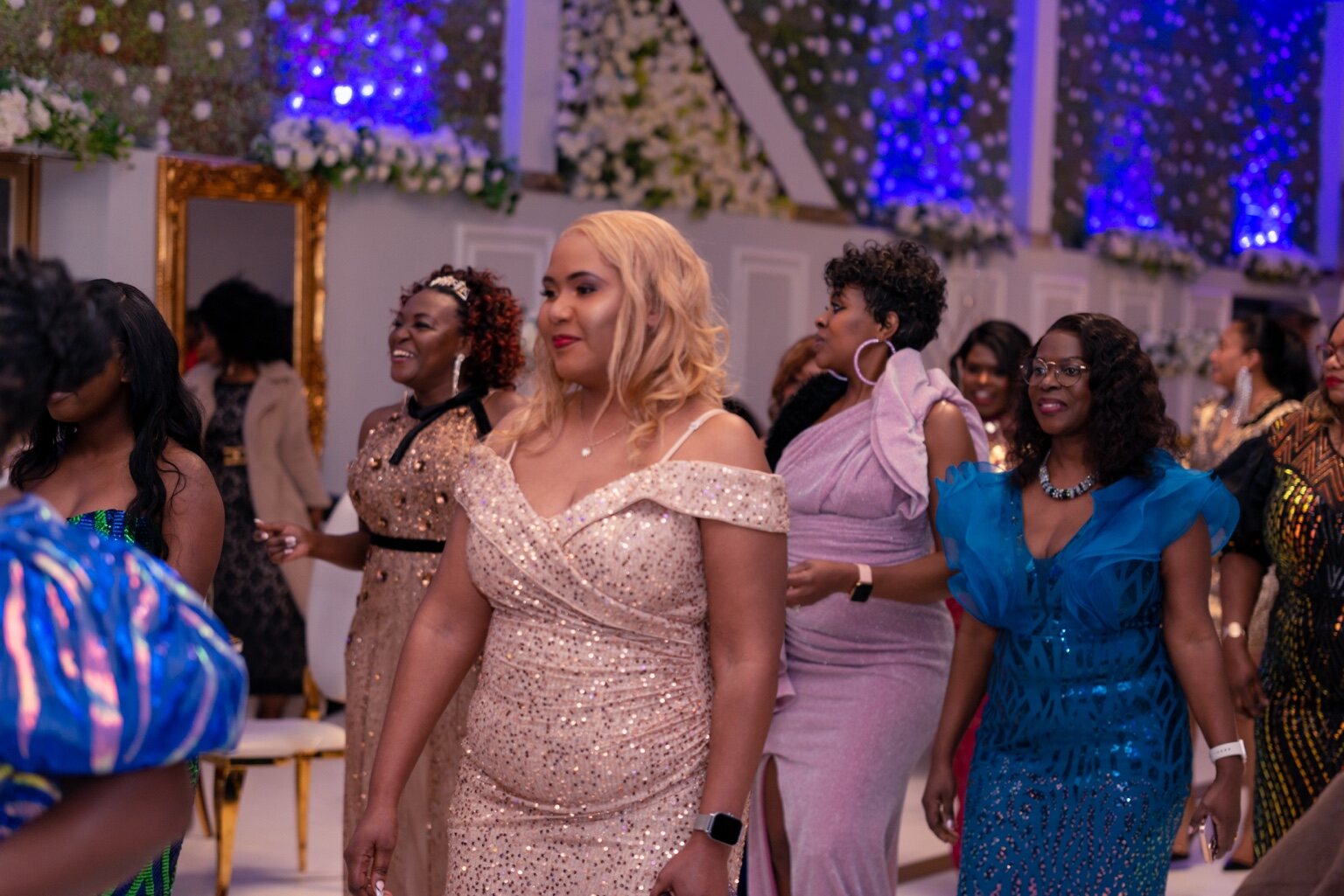Guests sharing a lively moment on the dance floor at the 2024 Grille Community Christmas Gala